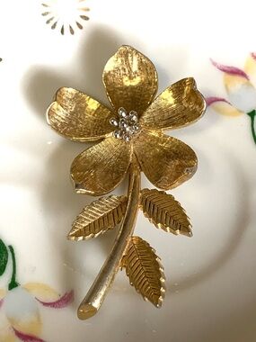 Keyes Gold Tone Floral Brooch with Rhinestone Center